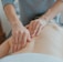 man massaging woman's body