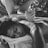 grayscale photo of woman hugging baby